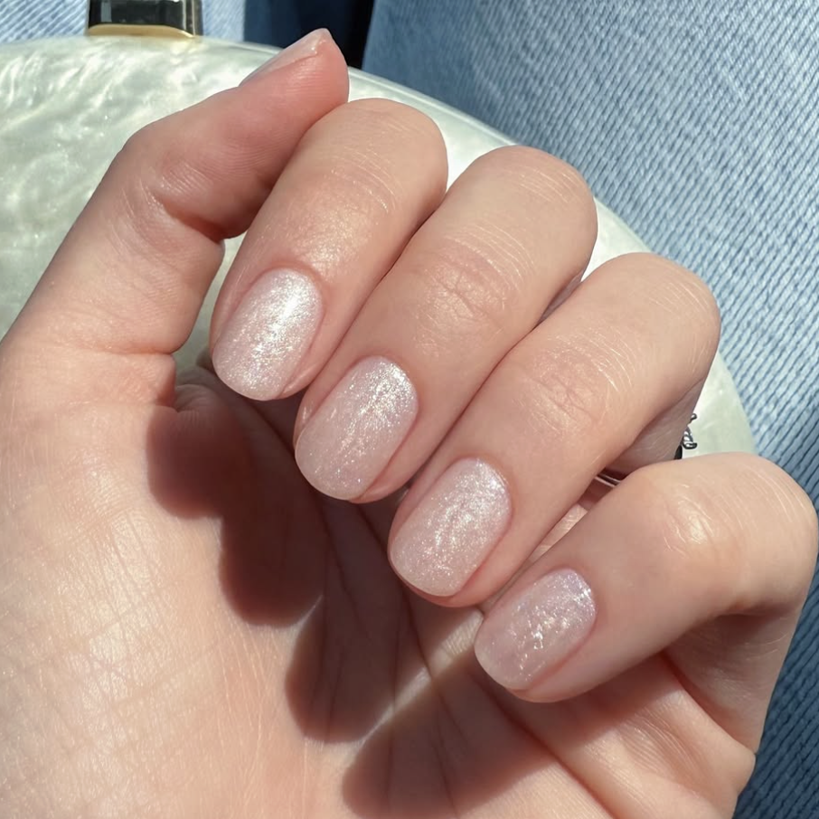 A swirly pearl engagement manicure.