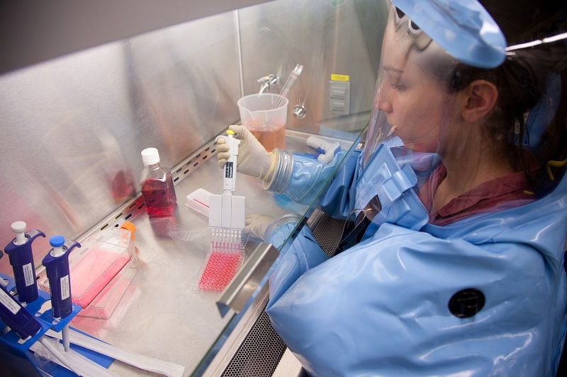 An employee of the Public Health Agency of Canada works inside of the National Microbiology Laboratory&#039;s &quot;level 4&quot; lab, which is designed with safety measure required for working on the most deadly infectious organisms.