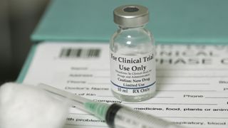 vaccine vial with label "for clinical trial use only"