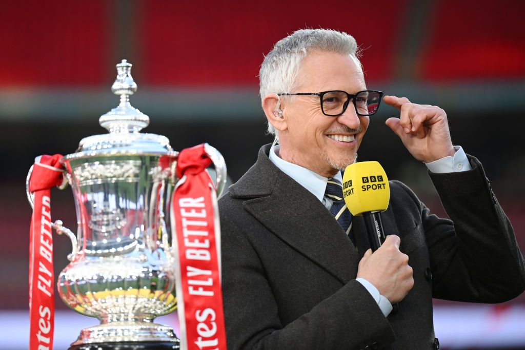 BBC presenter Gary Lineker looks on with the FA Cup trophy