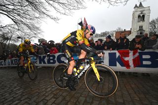 WEVELGEM BELGIUM MARCH 26 LR Christophe Laporte of France and Wout Van Aert of Belgium and Team JumboVisma compete passing through a Kemmelberg cobblestones sector during the 85th GentWevelgem in Flanders Fields 2023 Mens Elite a 2609km one day race from Ypres to Wevelgem UCIWT on March 26 2023 in Wevelgem Belgium Photo by Tim de WaeleGetty Images