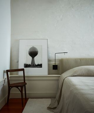 bedroom with beige walls and bed linen