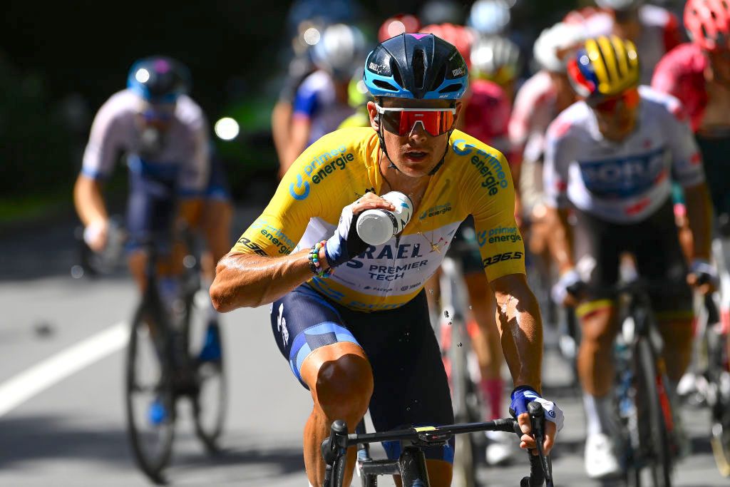 MALBUM, SWITZERLAND - JUNE 18: Jakob Fuglsang of Denmark and Team Israel - Premier Tech Yellow Leader Jersey refreshing during the 85th Tour de Suisse 2022 - Stage 7 a 194,6km stage from Ambri to Malbun 1560m / #tourdesuisse2022 / #WorldTour / on June 18, 2022 in Malbun, Switzerland. (Photo by Tim de Waele/Getty Images)