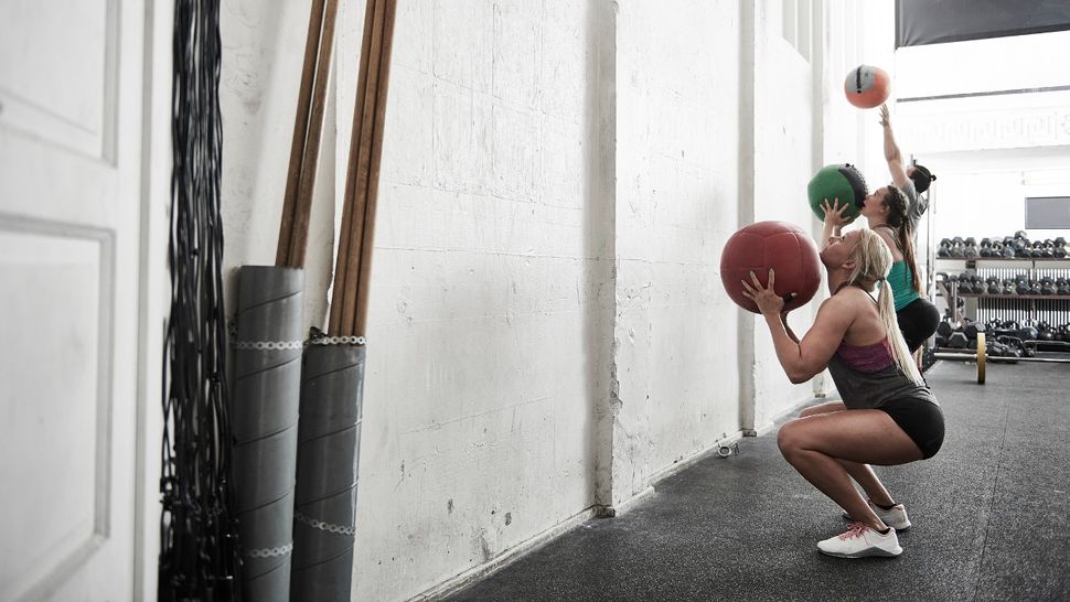 How To Do The Medicine Ball Squat Coach