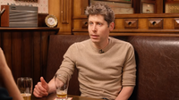 Sam Altman appears on an episode of the podcast Cheeky Pint, in a classic pub-style booth with two nearly empty pint glasses on the table in front of him.
