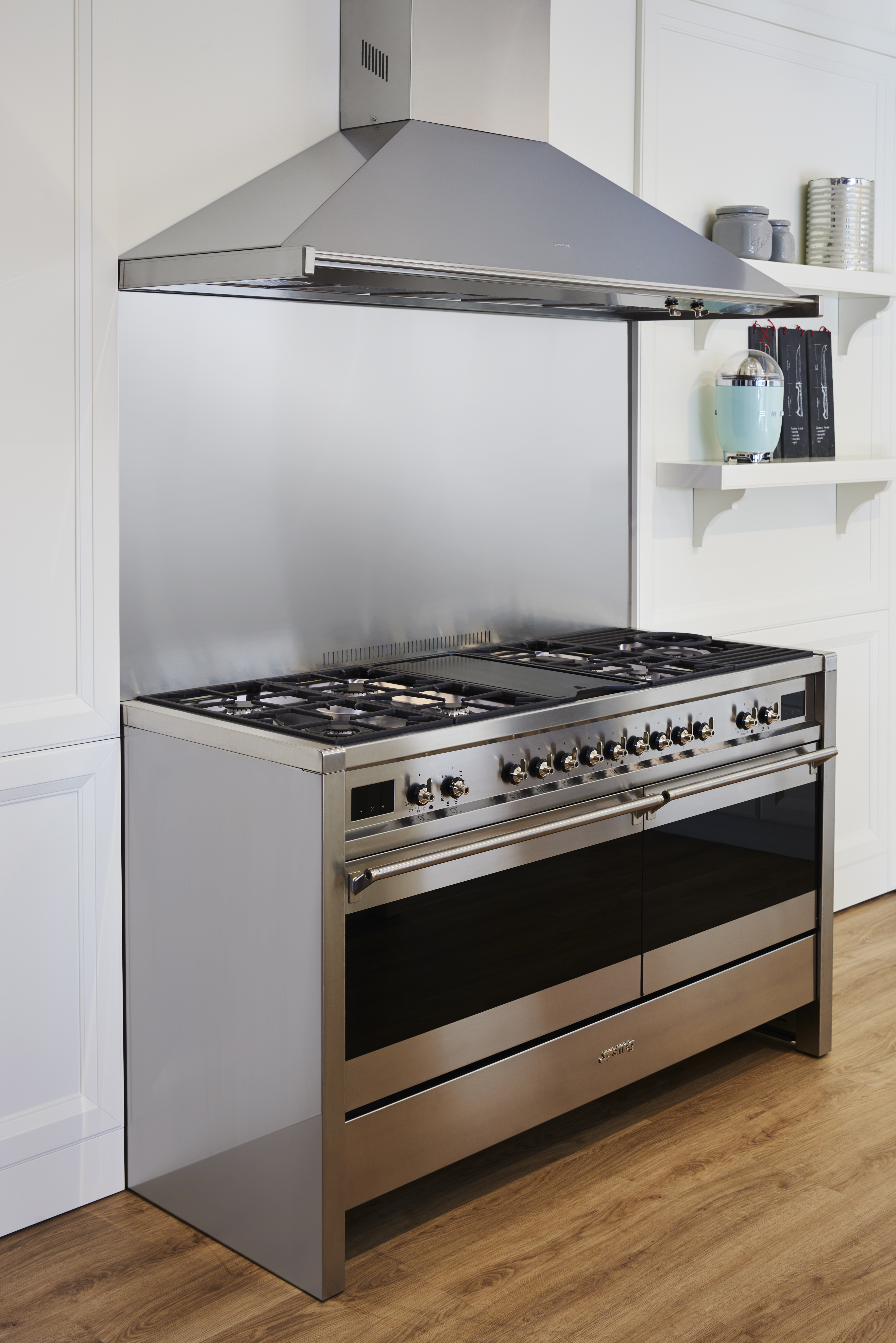 A kitchen with a stainless steel double oven