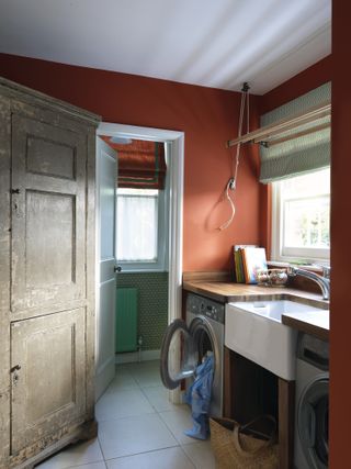 A rustic utility room idea with old wood cupboards.