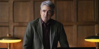 Hanna Dermot Mulroney looking perturbed in an office