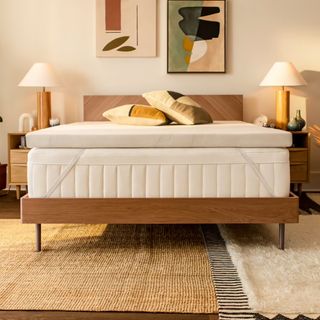 A Tempur-Pedic mattress topper on top of a bed in a contemporary bedroom
