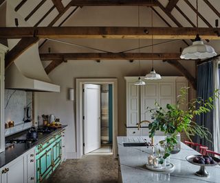 vaulted kitchen in farmhouse decorated with festive foliage