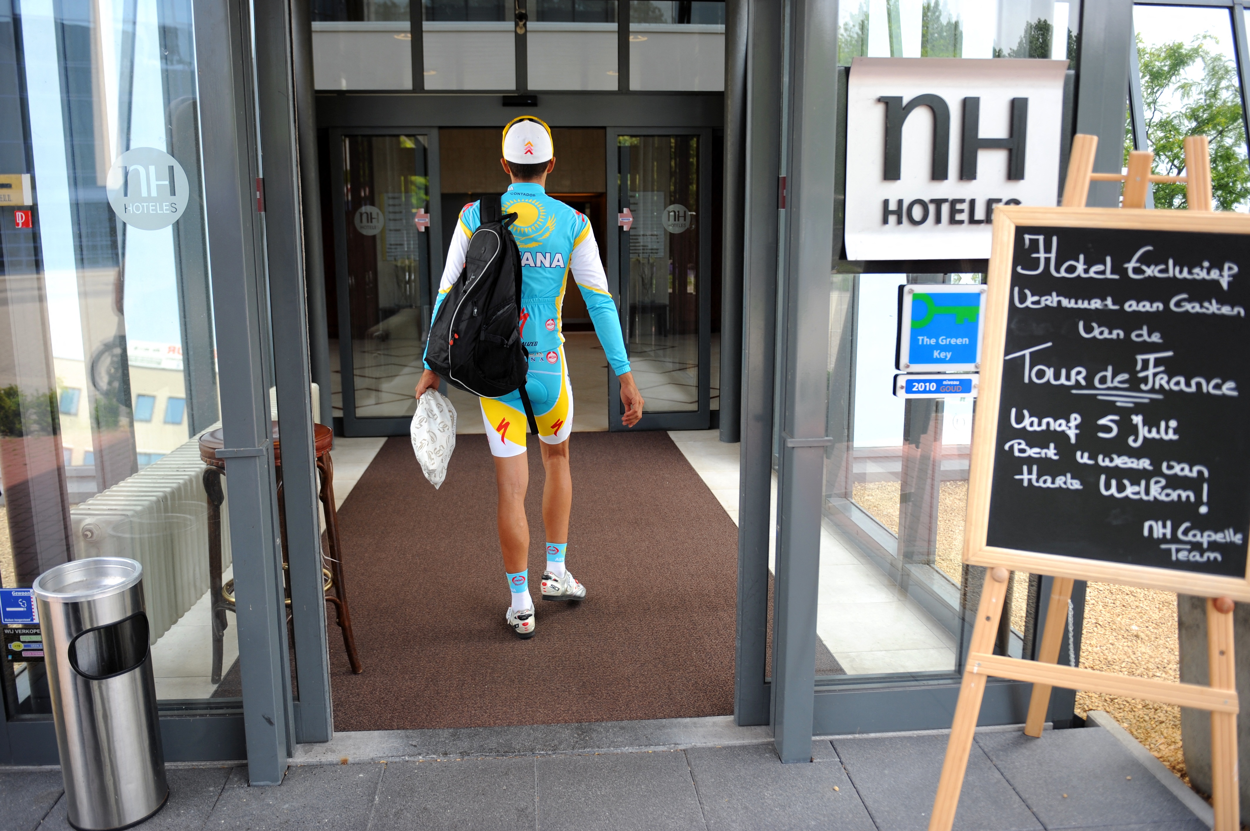 A rider walks into a hotel