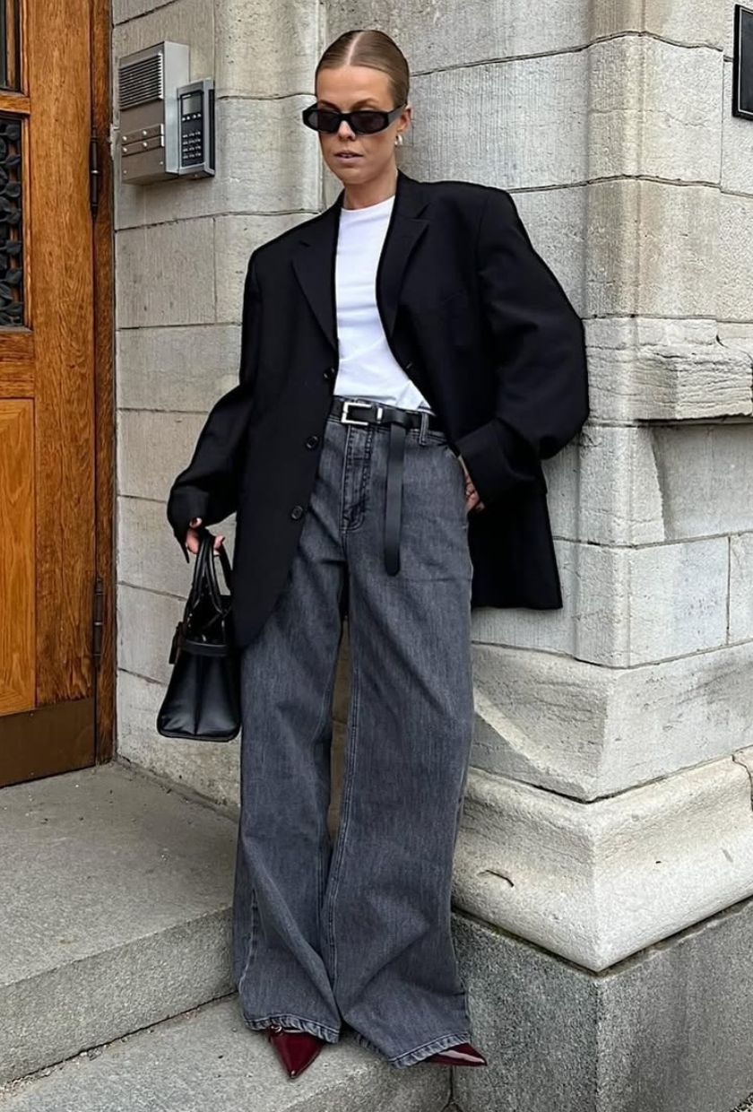 @haaannajohansson wears a black blazer, white tee, grey jeans, and burgundy mules