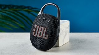A black JBL Clip 5 portable Bluetooth speaker