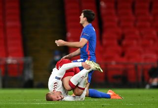 Kasper Dolberg after a foul by Harry Maguire