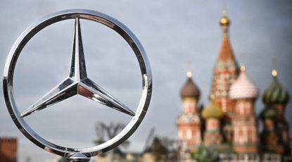The Mercedes-Benz emblem seen in front of St. Basil's Cathedral in Moscow. 
