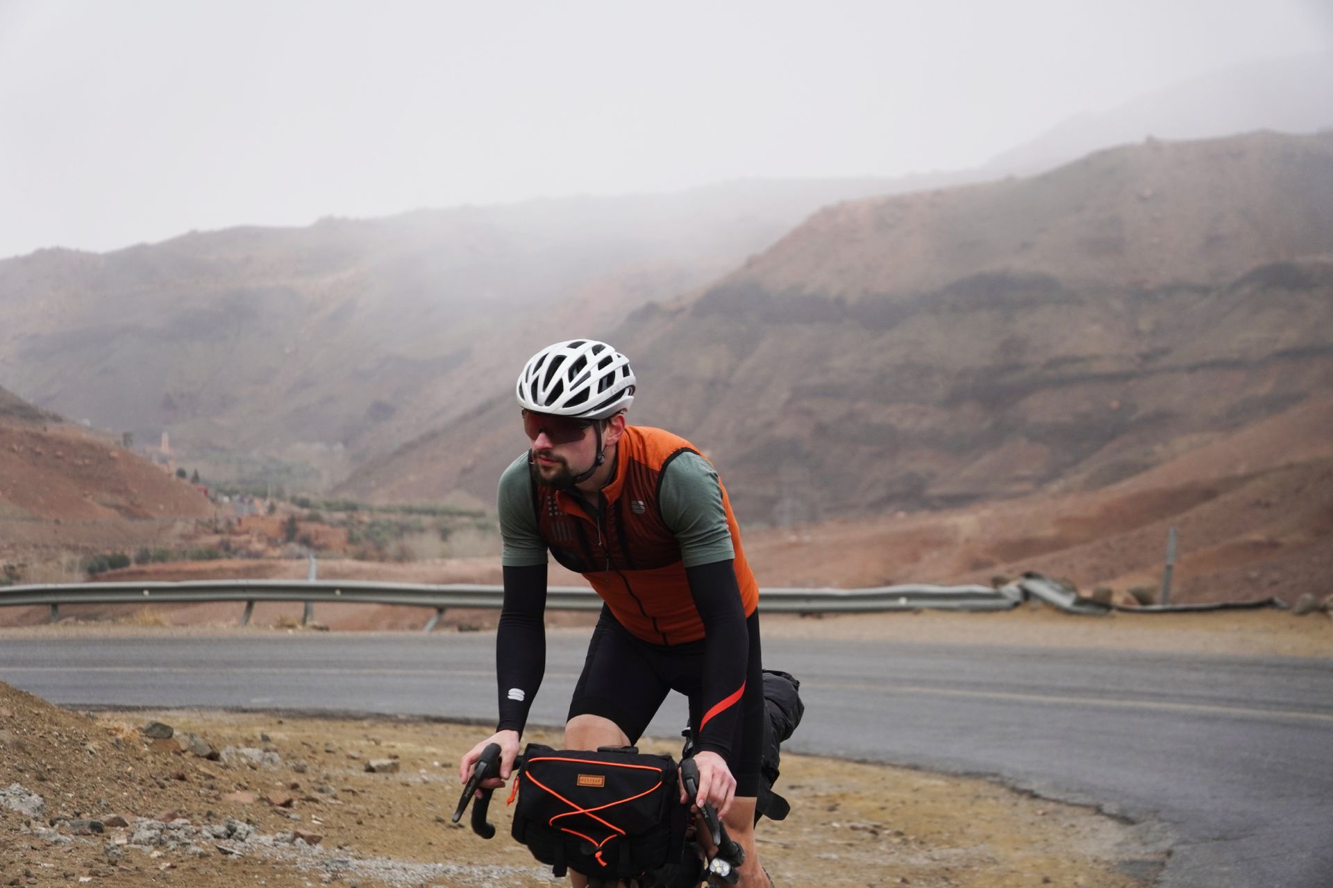 Image shows Stefan riding towards Agouim in Morocco