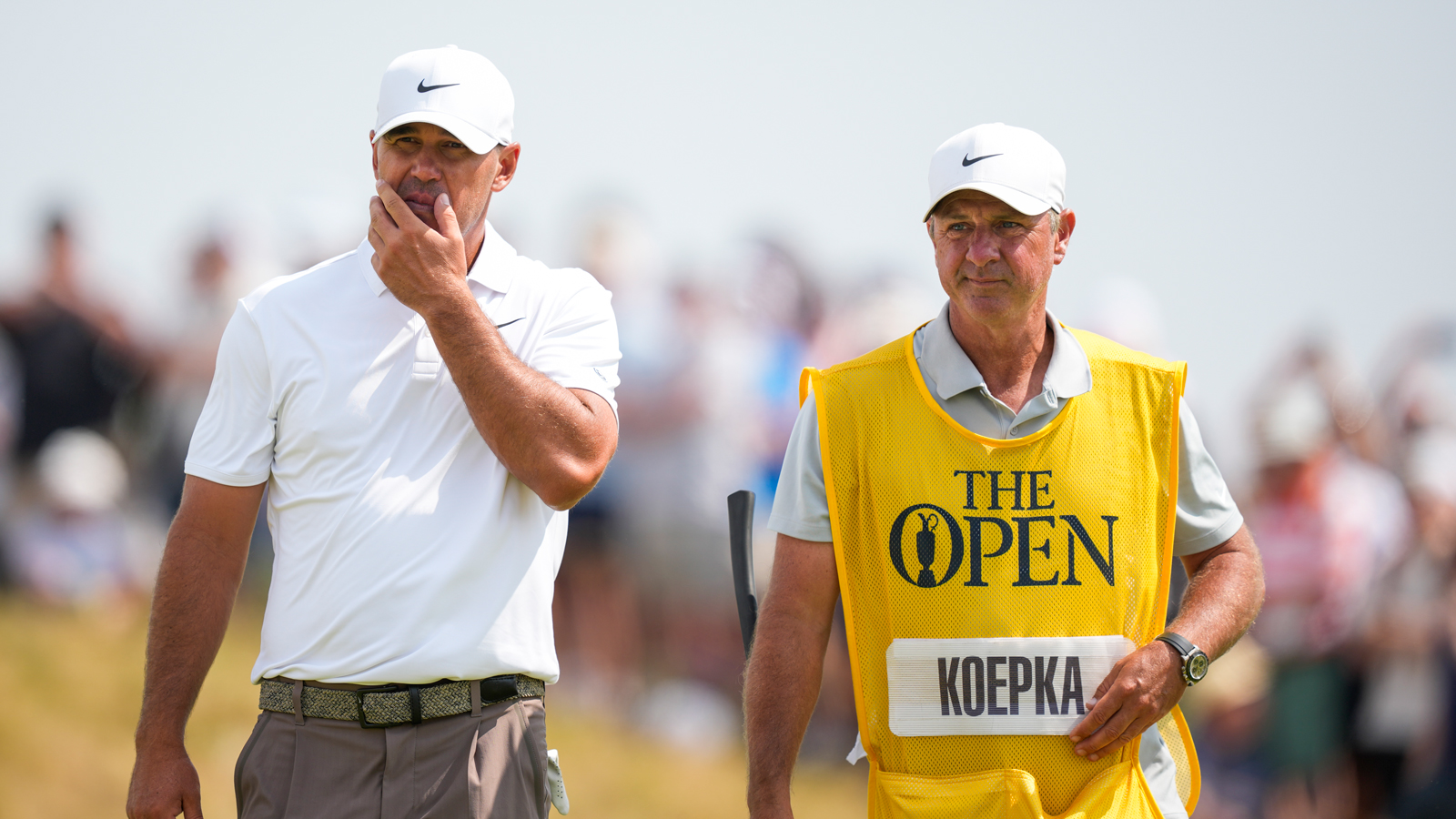Brooks Koepka chats to his caddie during The Open Championship