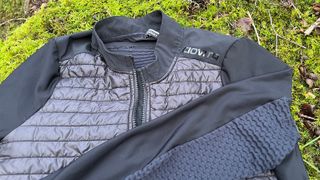 Closeup of cycling jacket lying on mossy ground