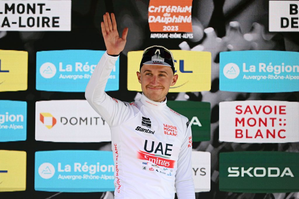BELMONTDELALOIRE FRANCE JUNE 07 Mikkel Bjerg of Denmark and UAE Team Emirates celebrates at podium as White best young jersey winner during the 75th Criterium du Dauphine 2023 Stage 4 individual time trial from Cours to BelmontdelaLoire 482m UCIWT on June 07 2023 in BelmontdelaLoire France Photo by Dario BelingheriGetty Images