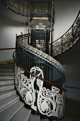 Spiral staircase with ornate white detailing