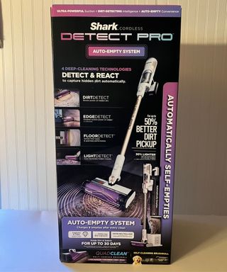 Shark Cordless Detect Pro Auto-Empty System Vacuum Cleaner in black, pink and purple branded cardboard box