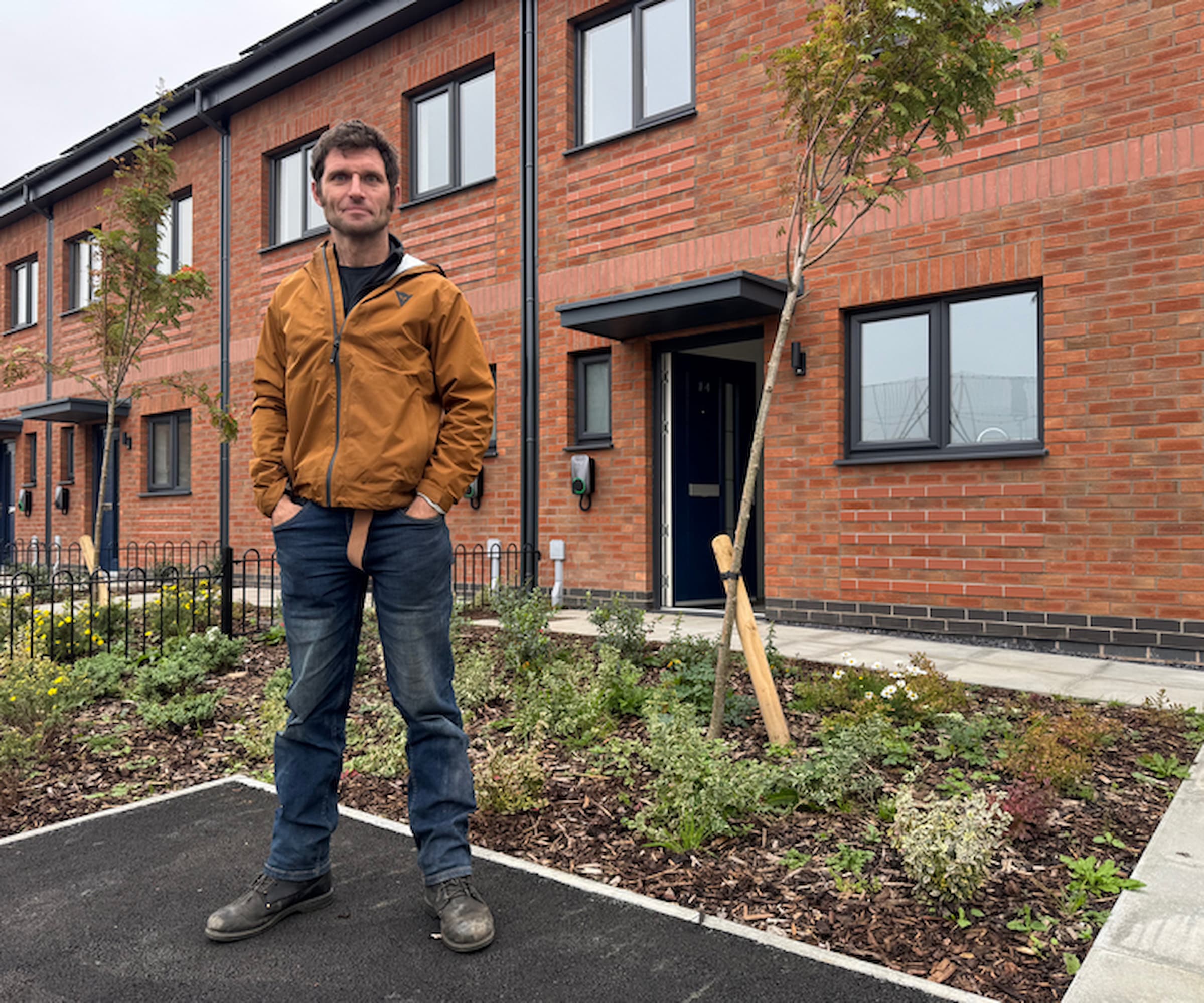 Guy Martin standing in front of a newly retrofitted Passivhaus home