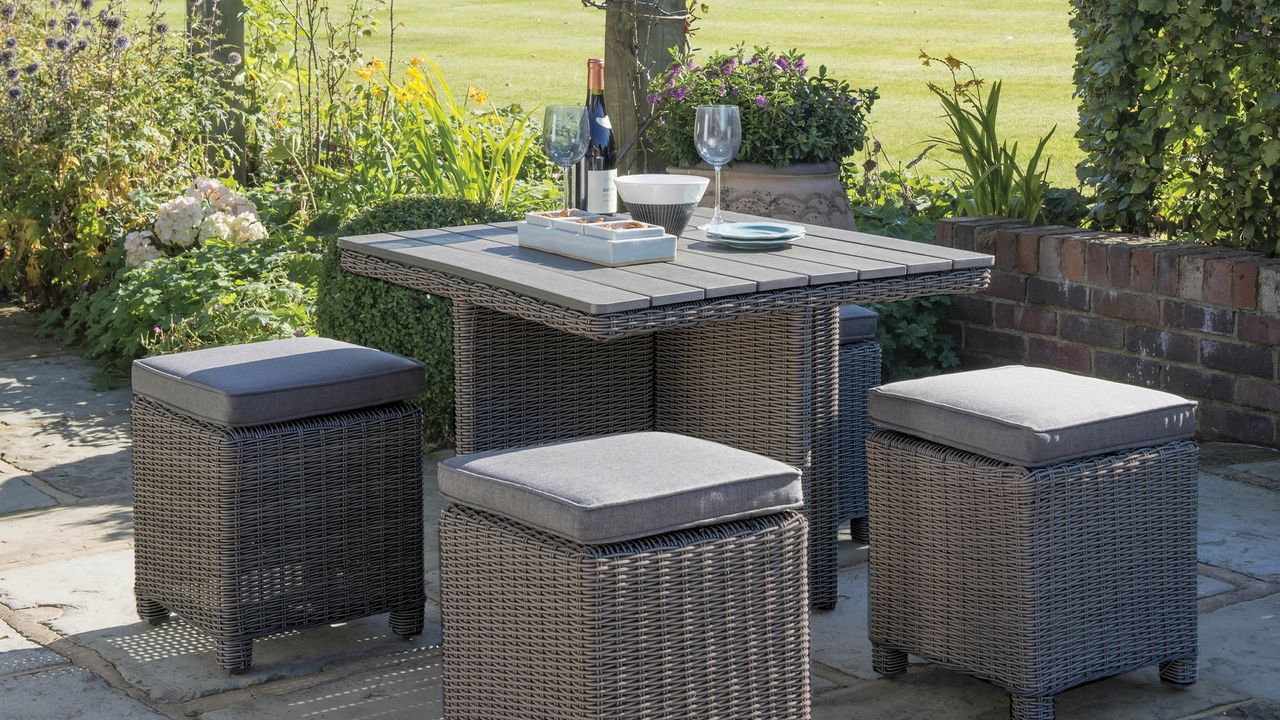 compact outdoor dining set with table and stools