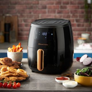 Russell Hobbs air fryer in kitchen surrounded by food