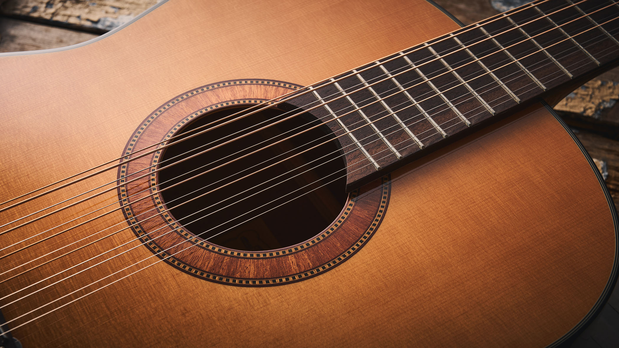 Framus&#039;s replica of original 12-string that John Lennon used on the Beatles&#039; Help! and Rubber Soul, photographed in close-up against a distressed wooden floor.