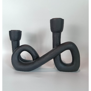black candelabra with a twisted iron design