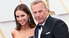 Christine Baumgartner and Kevin Costner at awards show.