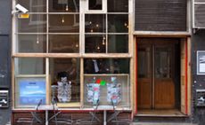 Outside Gopher Hole gallery, home to the current Project Heracles exhibition. A street shop with glass windows and a wooden door.