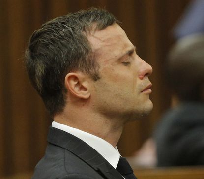 Oscar Pistorius walked through a South African courtroom after removing his prosthetic legs in order to show "how vulnerable he is."