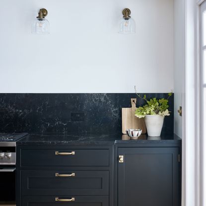 Black kitchen cabinets with black kitchen worktop