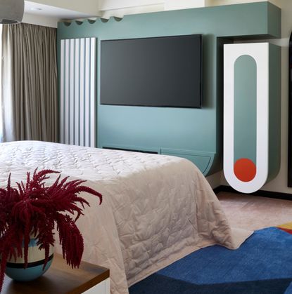 A bedroom with a TV unit