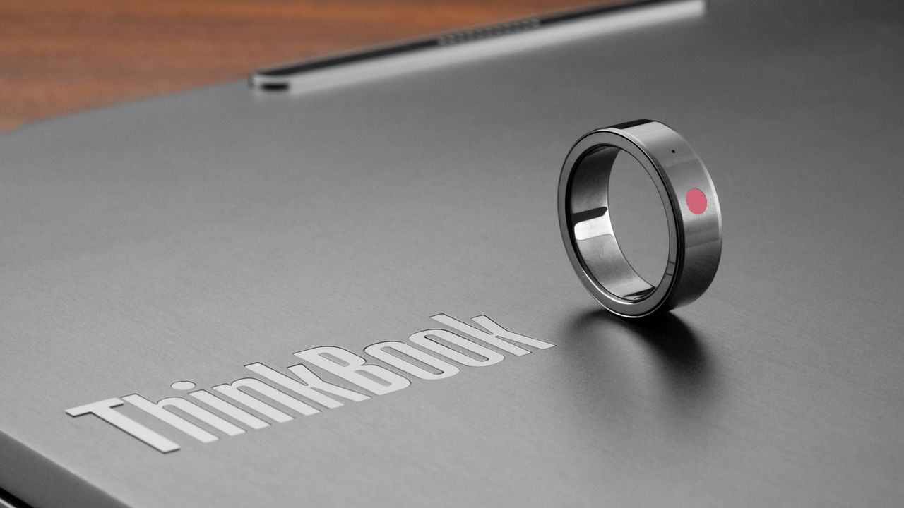 Lenovo AI Ring Proof of Concept next to ThinkBook slogan on laptop