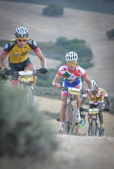 Burry Stander with Jacques Janse Van Rensburg, Burry Stander and Adrien Niyonshuti.