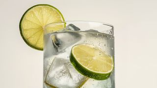 Non-alcoholic gin and tonic with lime wedge