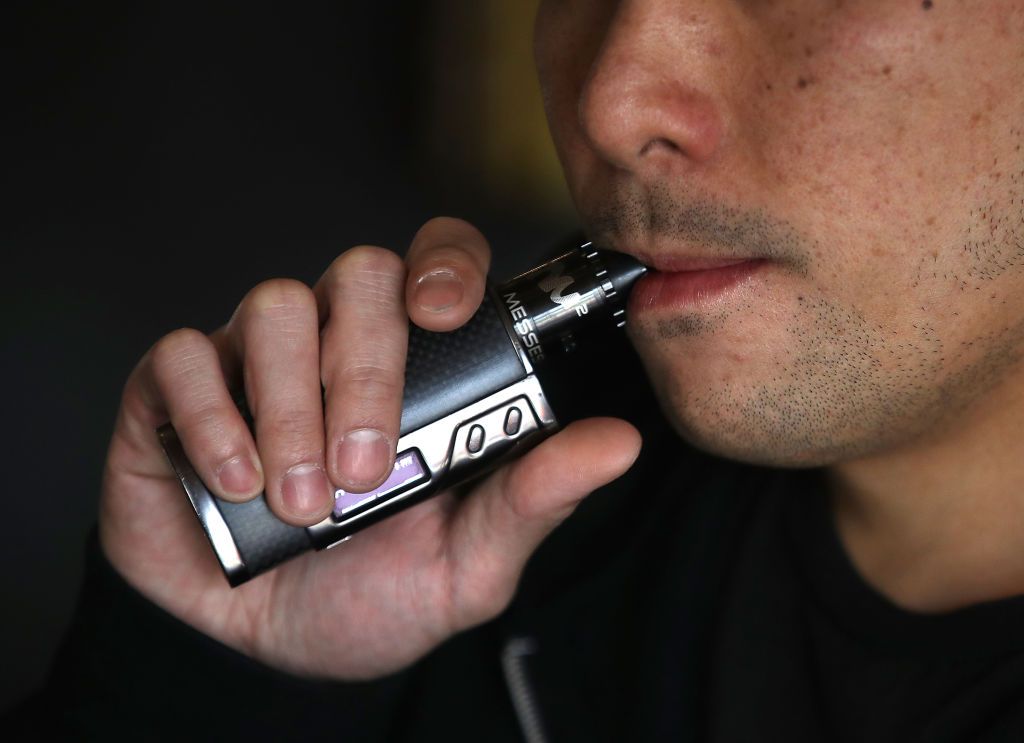 A man vapes.