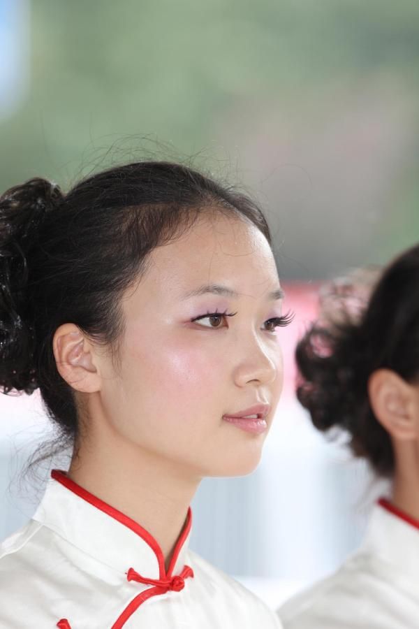 A local podium girl waits for the presentation to begin.