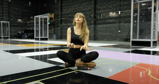 taylor swift wears black butt leggings with red lipstick in her "i can do it with a broken heart" music video