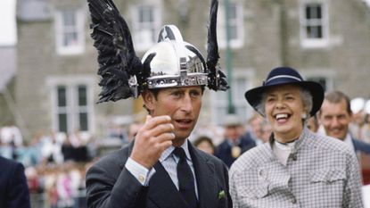 Prince Charles Trying On A Viking Helmet During A Visit To The Shetland Isles, Scotland