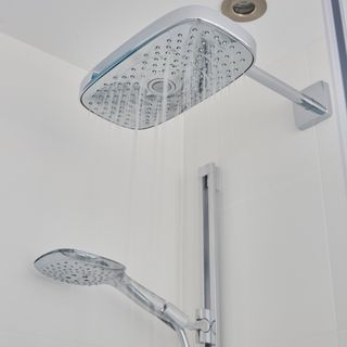 Two shower heads with running water