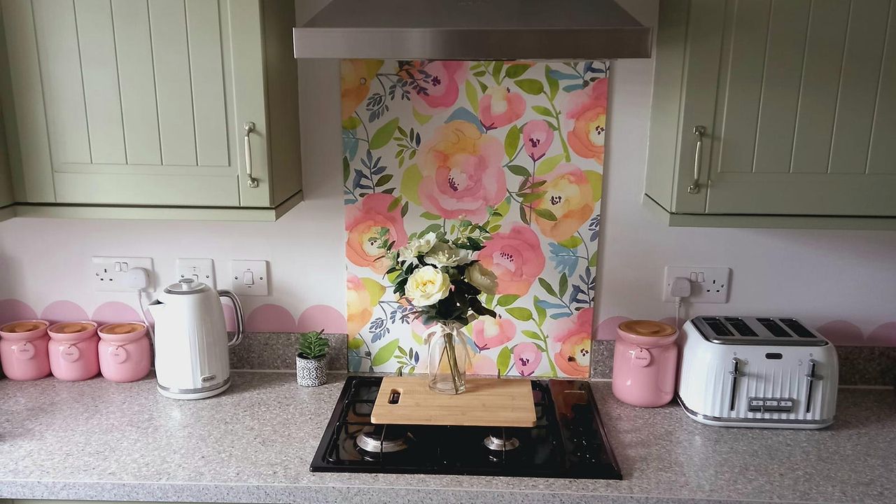 kitchen with floral wallpaper as a splashback