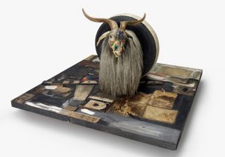 Wooden goat and tyre showpiece