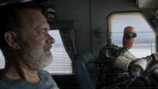 Tom Hanks and his robot driving in an RV in Finch.