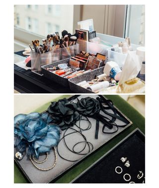 Makeup products and fashion accessories arranged on a table.