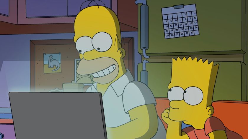 Homer smiling at laptop screen while Bart is bored in The Simpsons