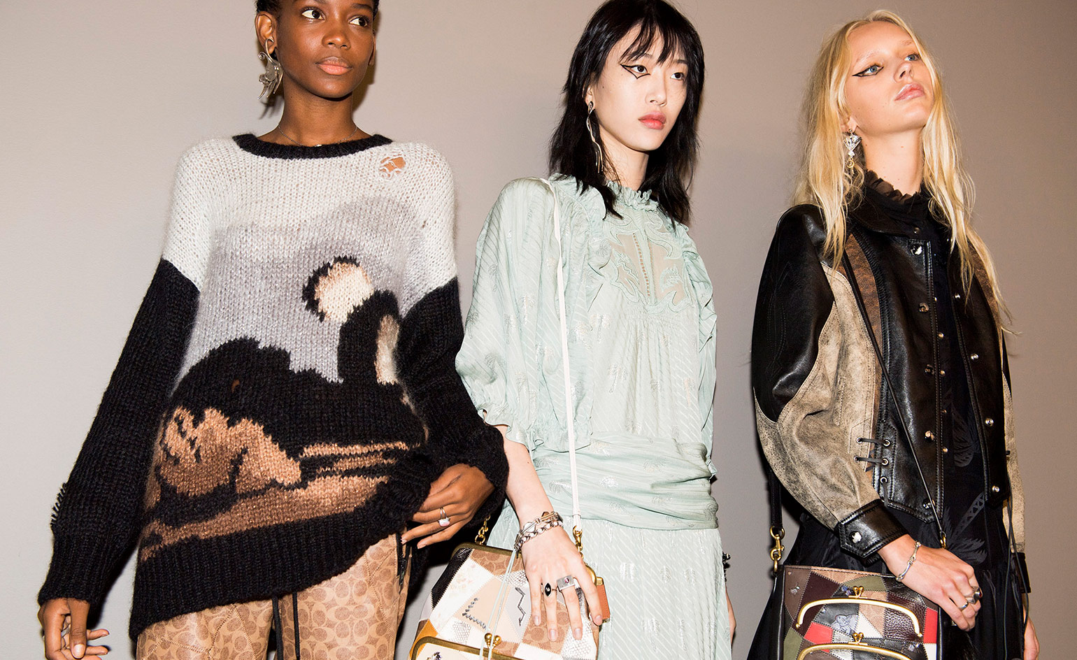 Models wear knit, blouse and leather jacket in black, white and brown