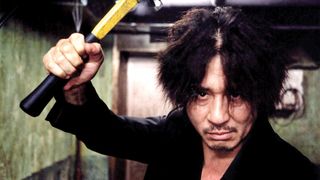 Choi Min-sik wields a bat in a creepy hallway in Park Chan-wook's film 'Oldboy'